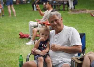 A man and his granddaughter enjoying tacos during the Taco and Art Fest.